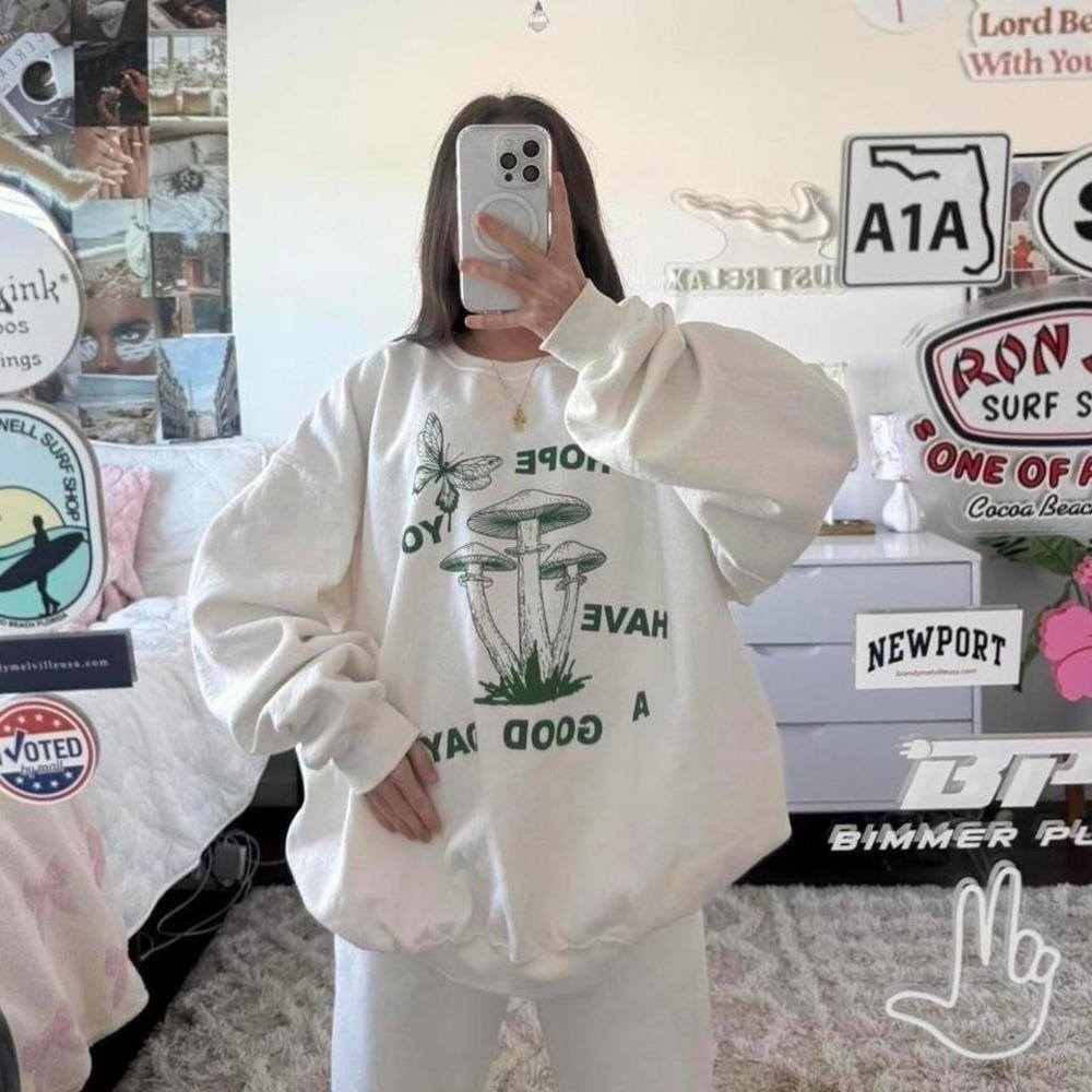 white and green urban outfitters mushroom sweatshirt